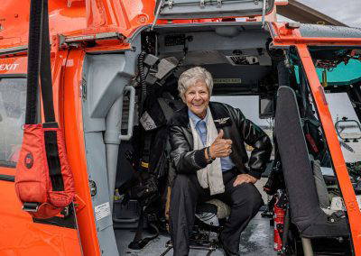 A visitor sits inside the Coast Guard helicopter