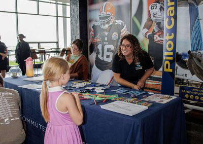 A girl visits an aviation careers table at Girls in Aviation Day