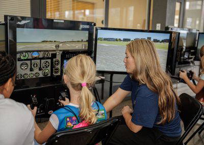 Girls take a turn on the flight simulator