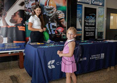 A girl stops at a pilot careers table