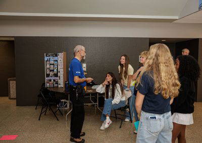 Girls visit the chapter display table