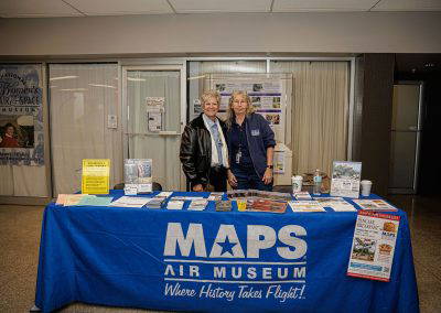 Volunteers at the MAPS Air Museum table
