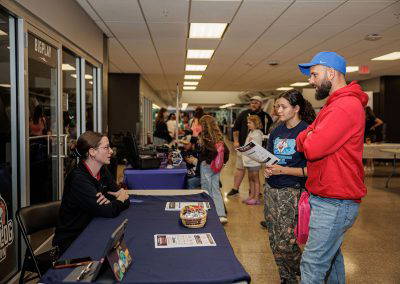 Families visit the exhibitor tables