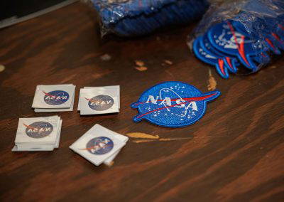 NASA stickers and patches on a table
